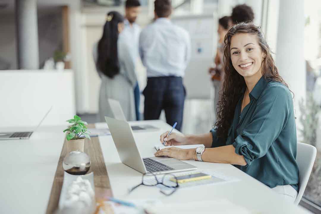 Creating success for herself Young woman smiling at camera at workplace in an office