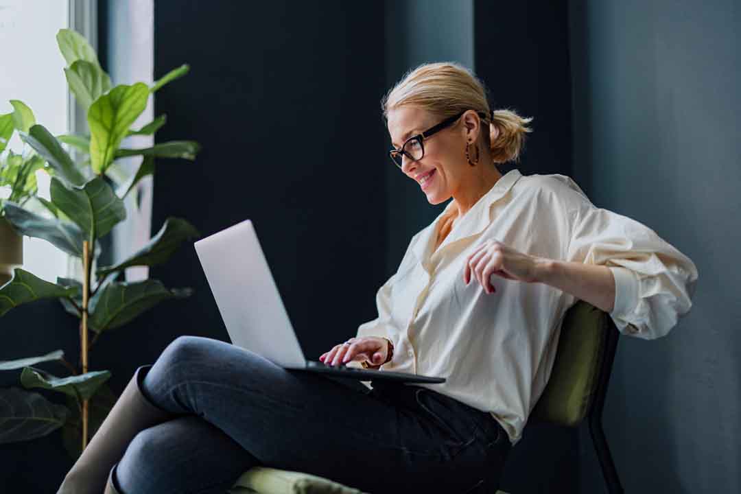 Happy Business Woman Using Laptop Computer In The Office Happy Business Woman Using Laptop Computer In The Office