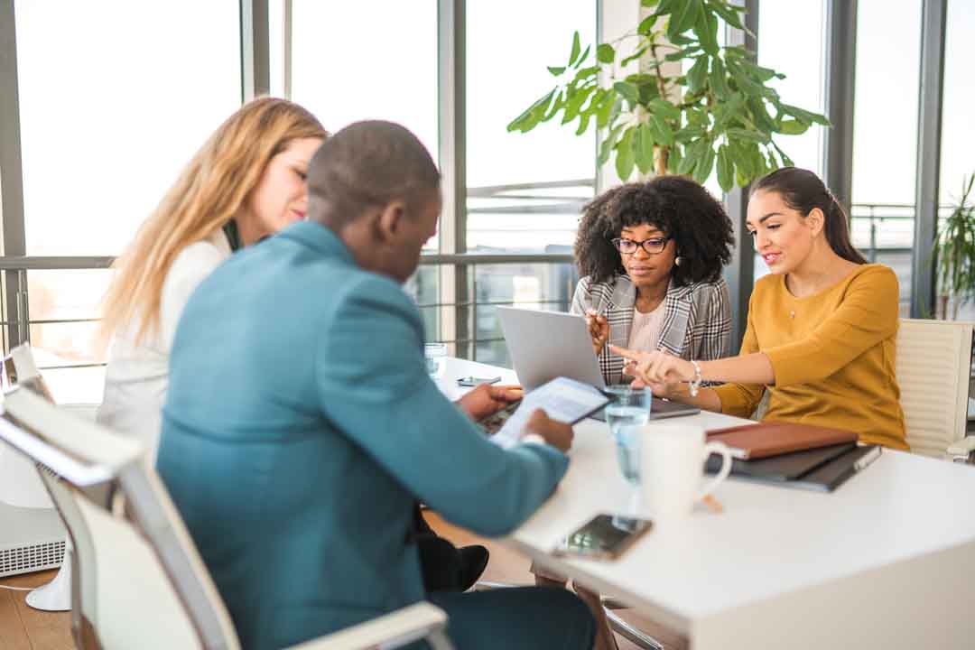 Hard Working Business Team Using Wireless Technology Hard working business team